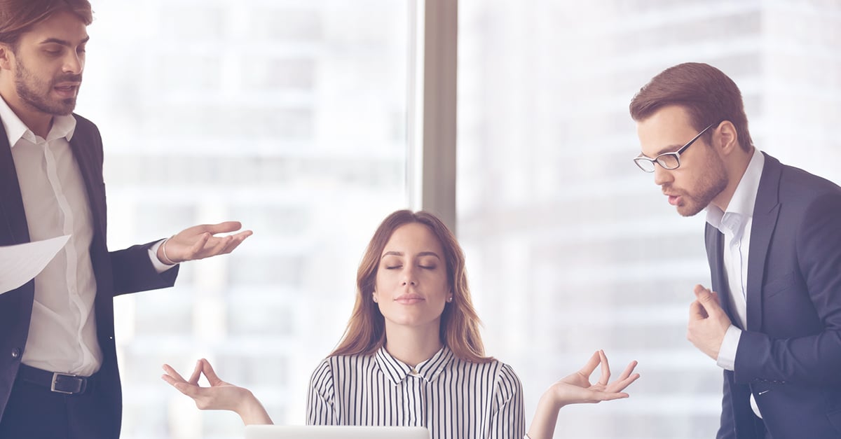 woman meditating and finding peace while coworkers yell